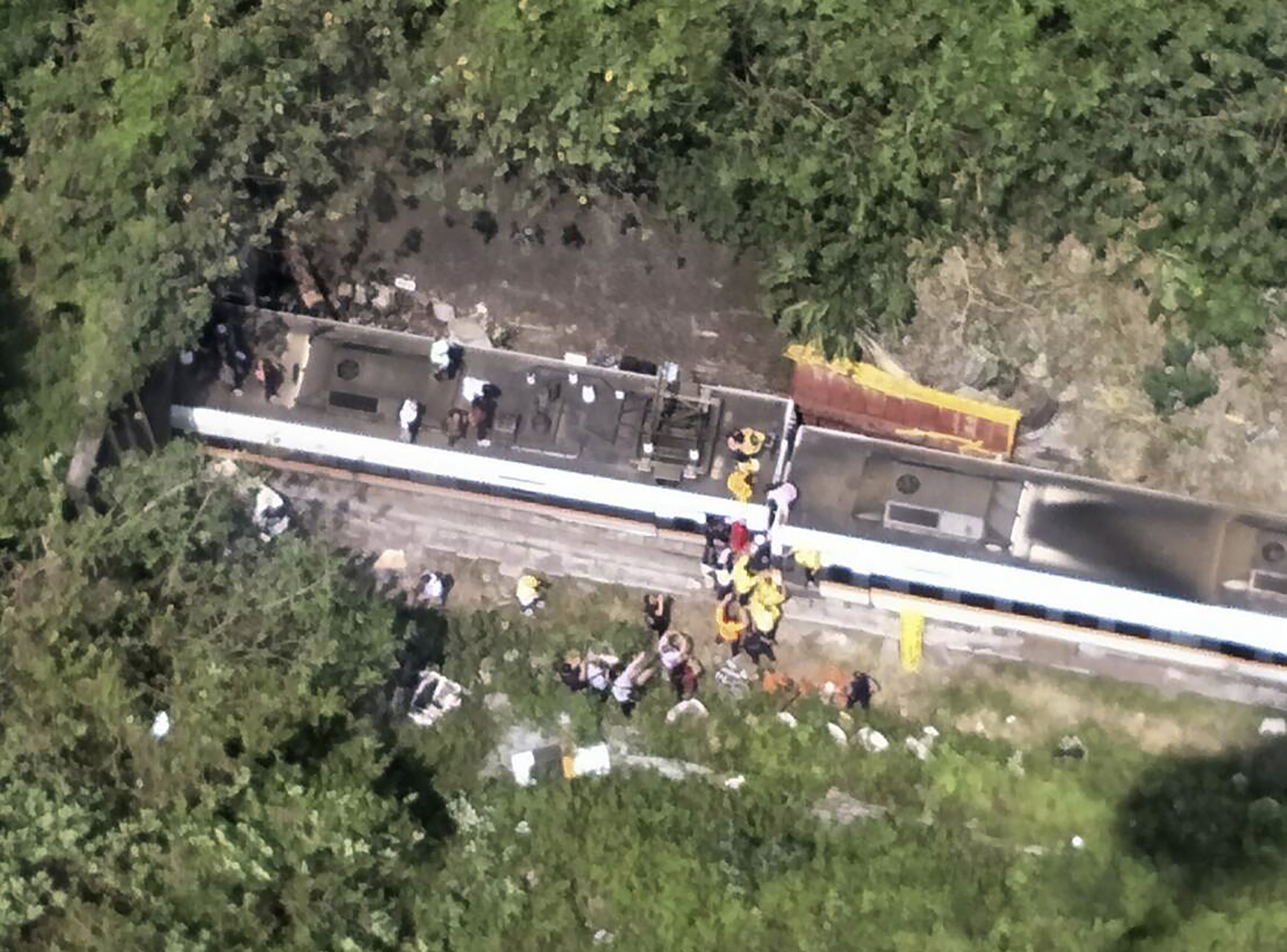 Photos: Train derails in Taiwan, killing at least 48 and injuring dozens