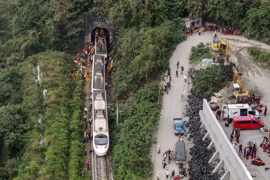 Photos: Train derails in Taiwan, killing at least 48 and injuring dozens