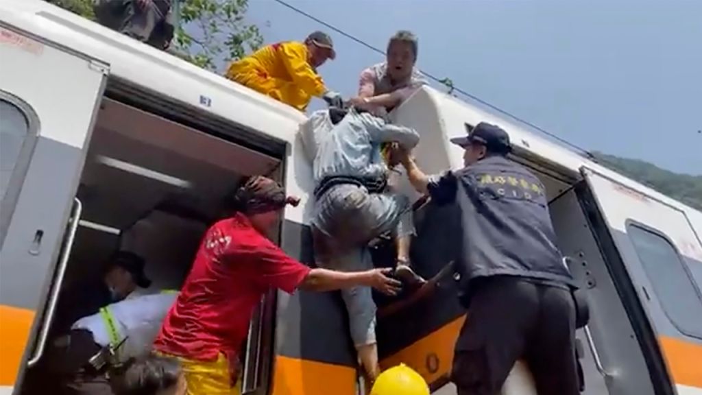 Photos: Train derails in Taiwan, killing at least 48 and injuring dozens