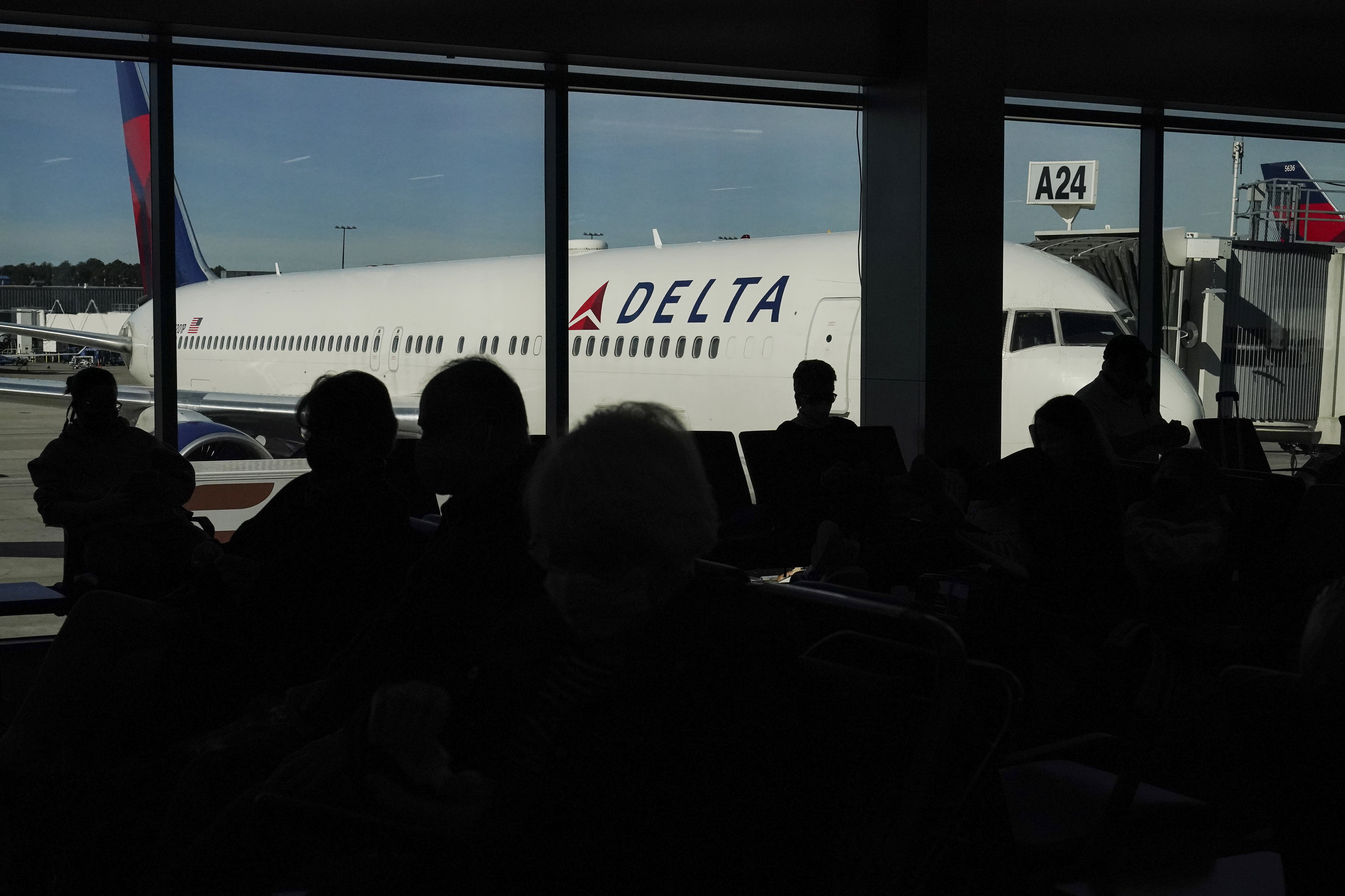Photos: Thanksgiving travelers flock to airports, freeways ahead of holiday