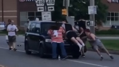 protester hit by car