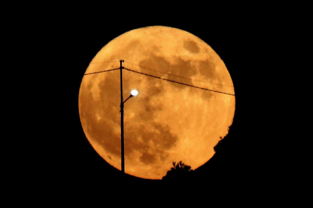 Photos: Halloween Blue Moon brightens the night sky