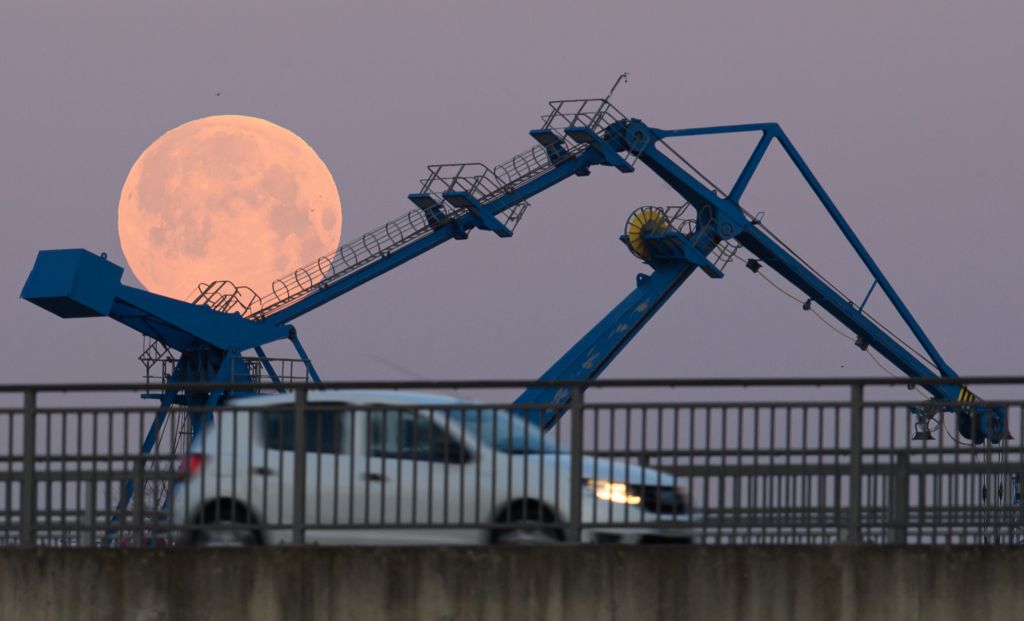 Photos: Super Pink Moon, April's full moon, brightens the night sky