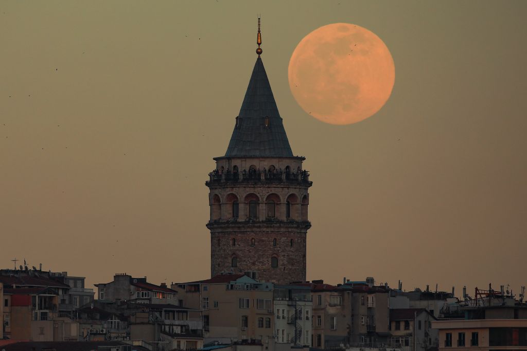Photos: Super Pink Moon, April's full moon, brightens the night sky