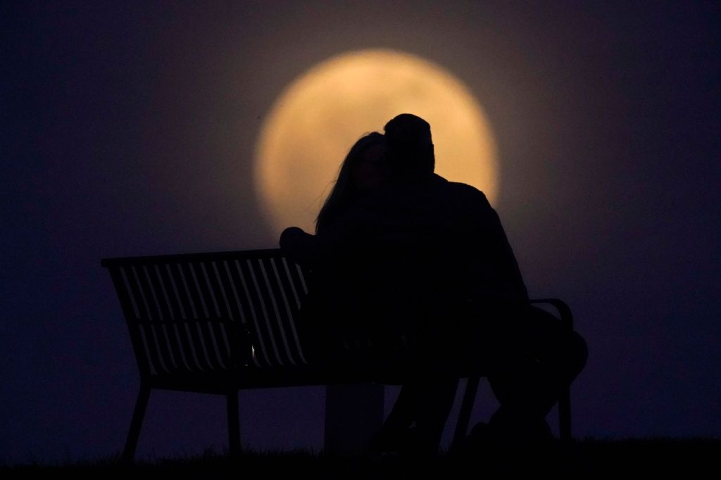 Photos: Super Pink Moon, April's full moon, brightens the night sky