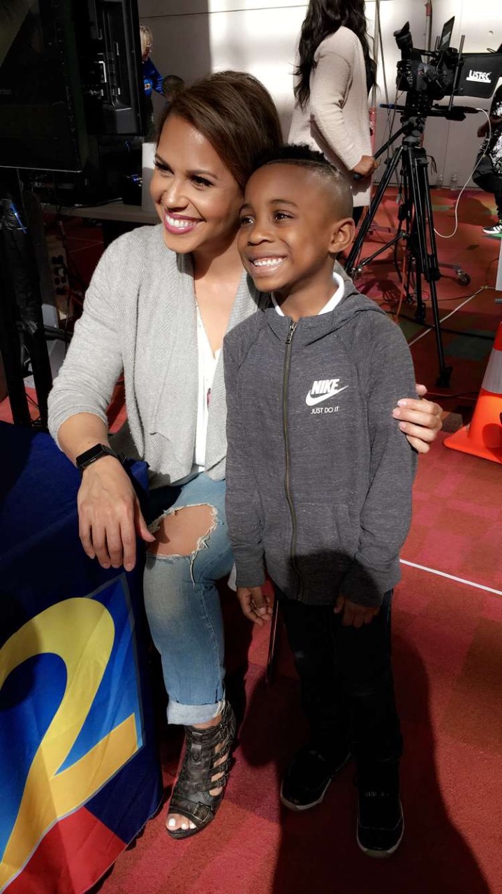 Jovita with a young fan at the Atlanta Car Show