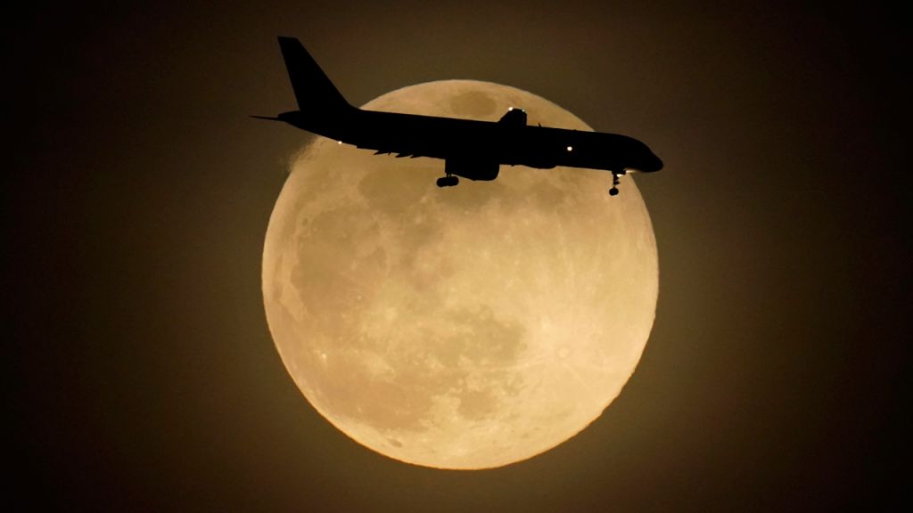 Photos: Super Pink Moon, April's full moon, brightens the night sky