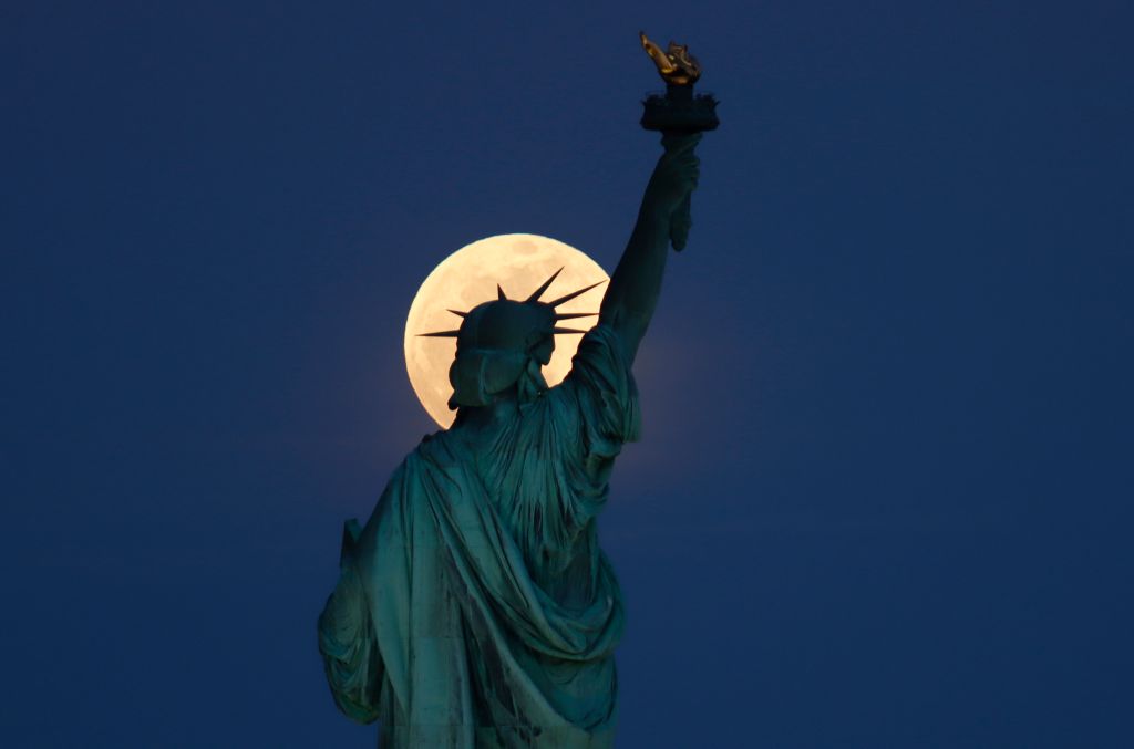 Photos: Super Pink Moon, April's full moon, brightens the night sky