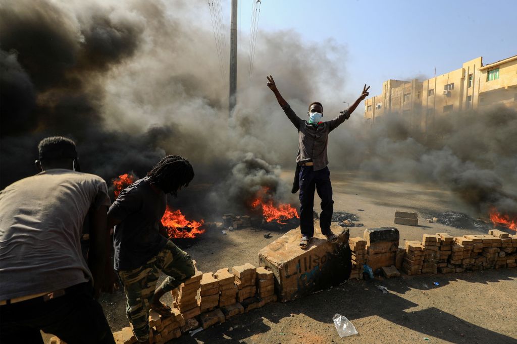 Photos: Sudanese protesters flood streets amid reports of possible military coup