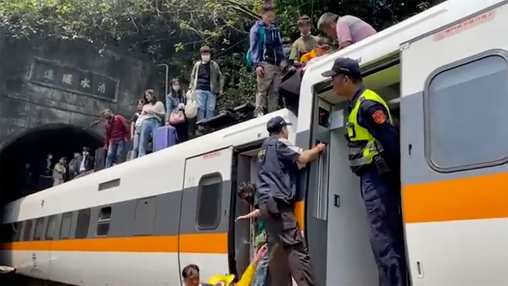 Photos: Train derails in Taiwan, killing at least 48 and injuring dozens