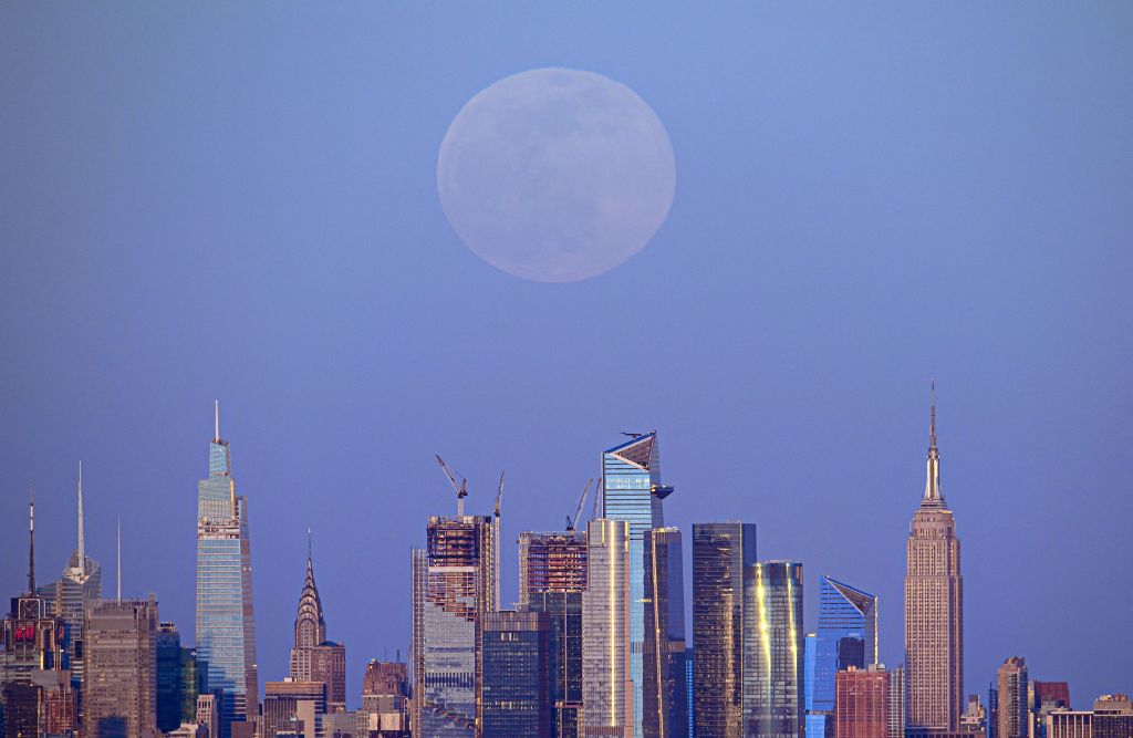 Photos: Super Pink Moon, April's full moon, brightens the night sky