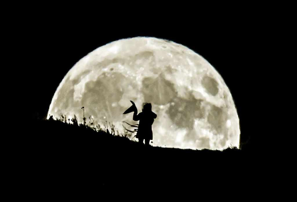 Photos: Halloween Blue Moon brightens the night sky