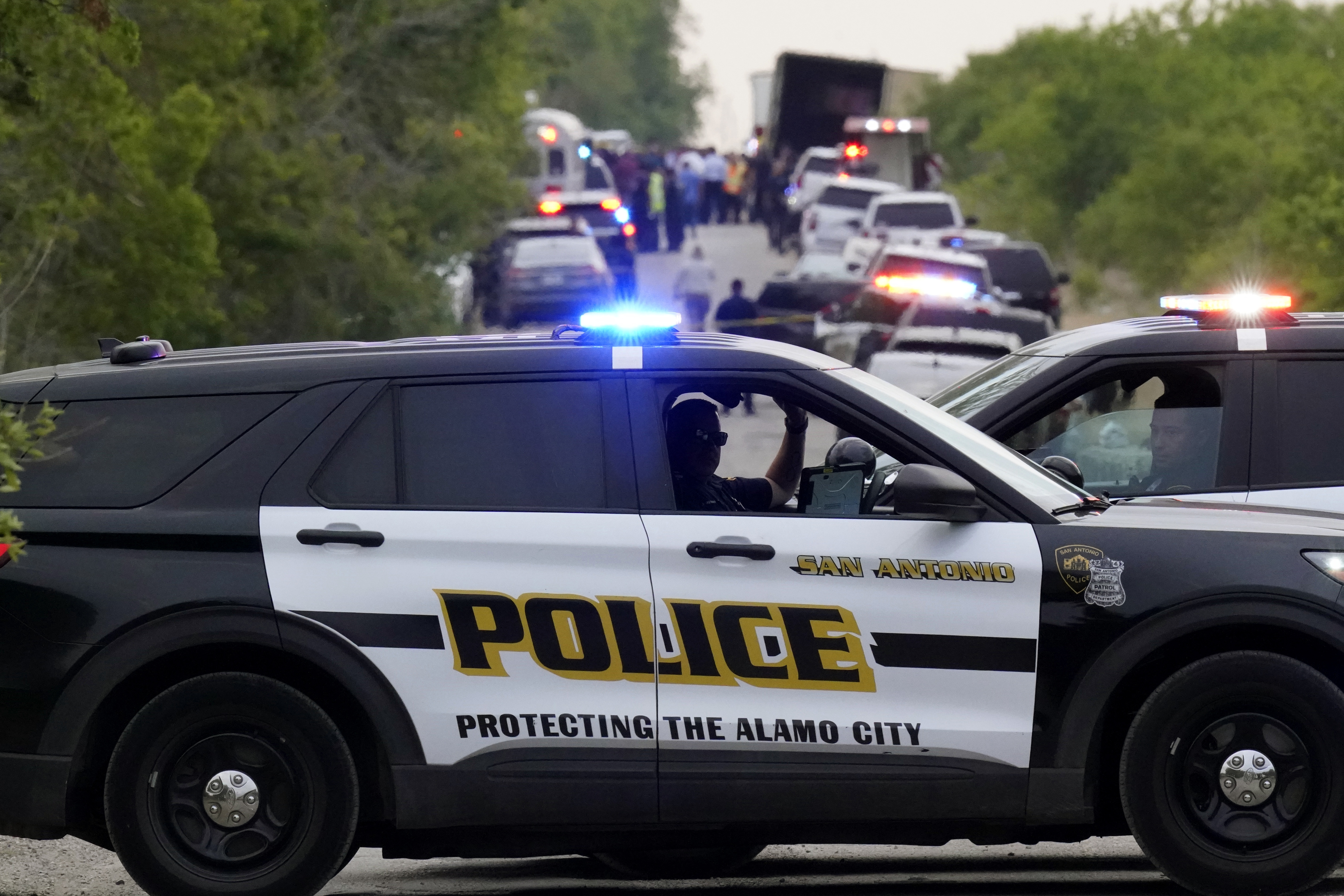 Photos: Dozens of suspected migrants found dead inside big-rig in San Antonio