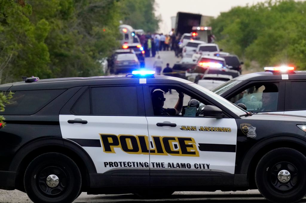 Photos: Dozens of suspected migrants found dead inside big-rig in San Antonio
