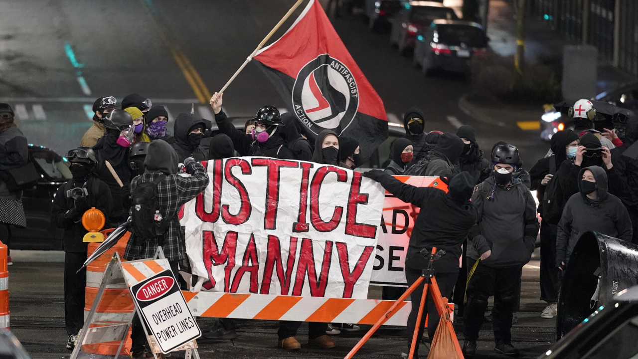 Photos: Protests erupt after police officer drives through crowd in Tacoma, Washington