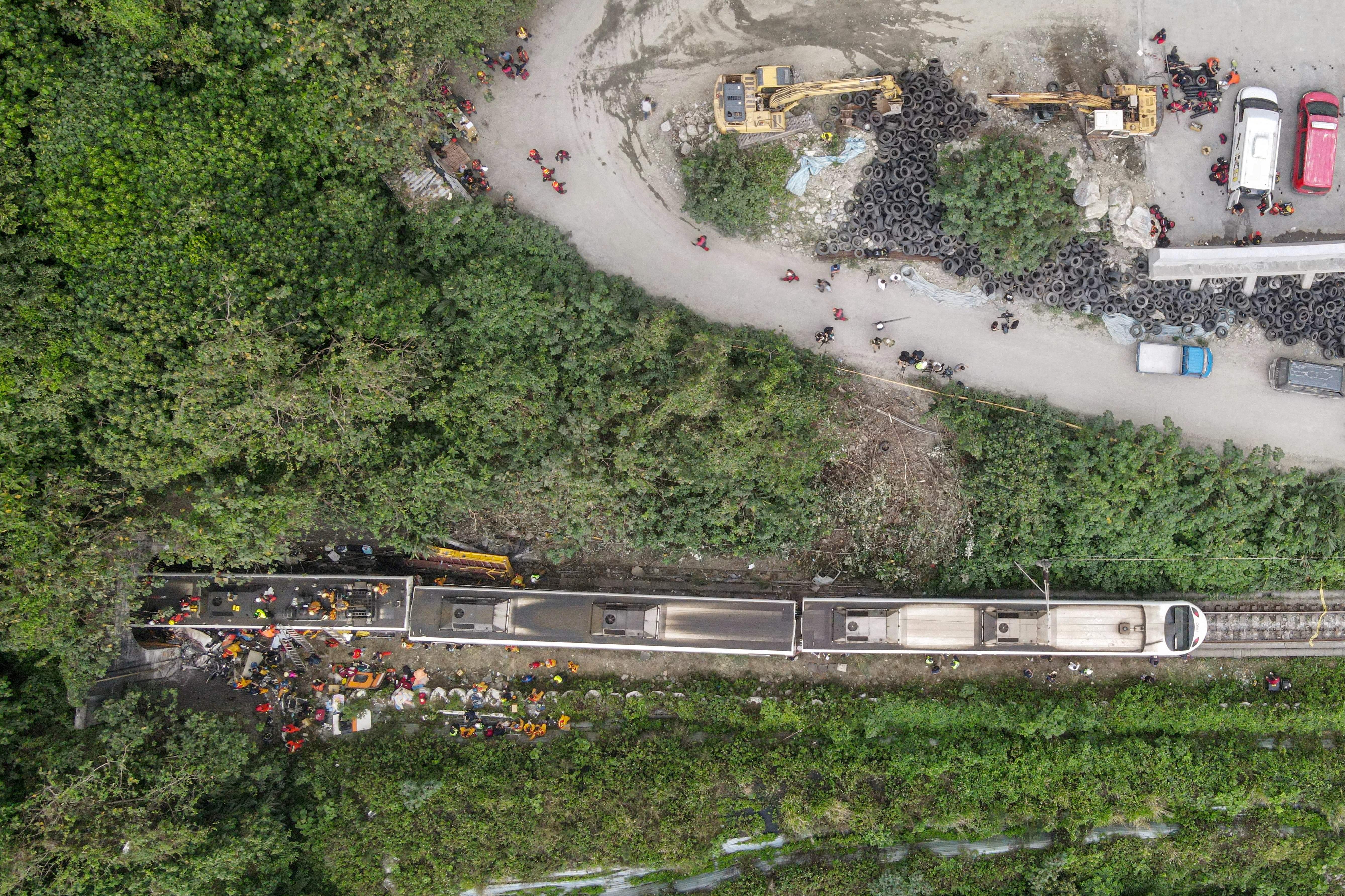 Photos: Train derails in Taiwan, killing at least 48 and injuring dozens