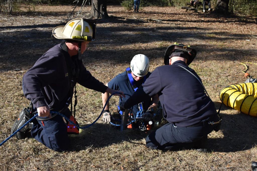 Photos: Florida firefighters rescue dog trapped down 15-foot hole