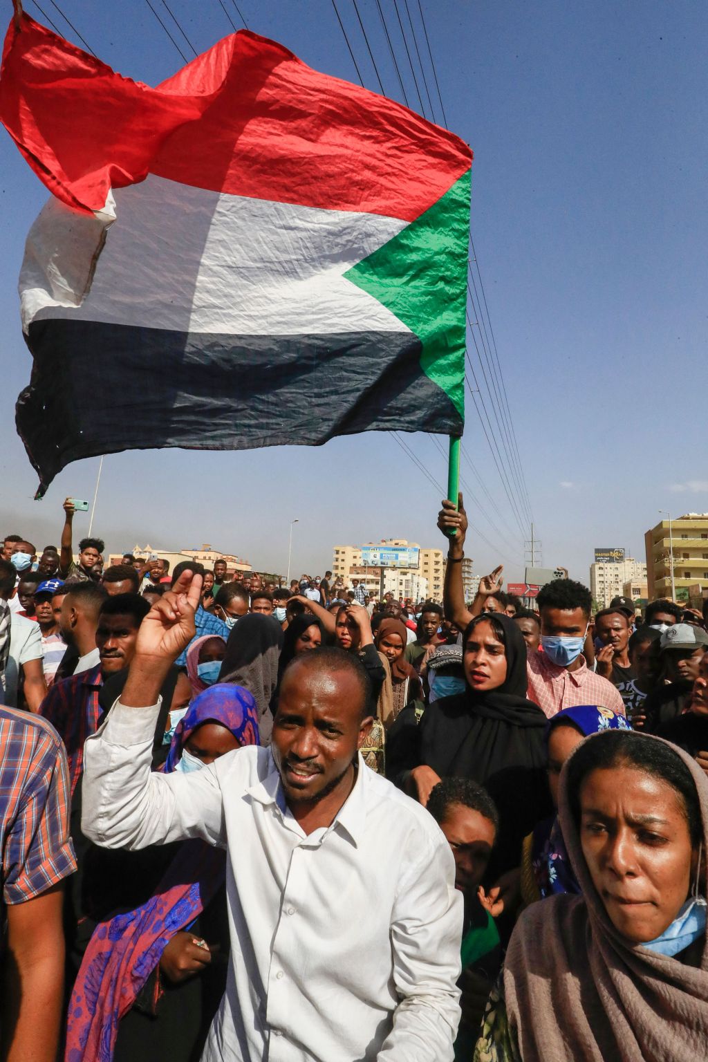Photos: Sudanese protesters flood streets amid reports of possible military coup