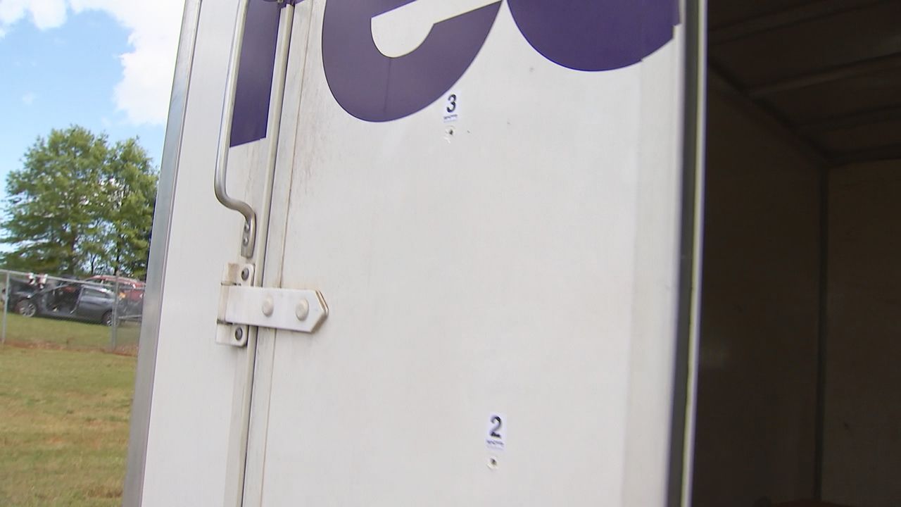 FedEx driver shot at after running over family’s dog; mother, son arrested, authorities say