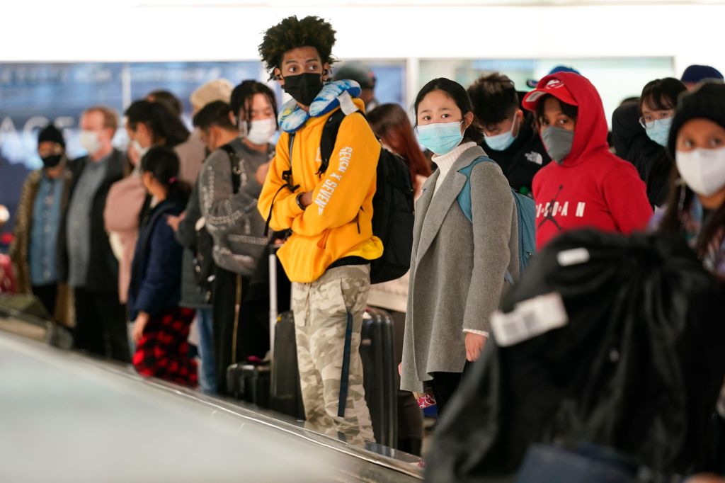 Photos: Thanksgiving travelers flock to airports, freeways ahead of holiday