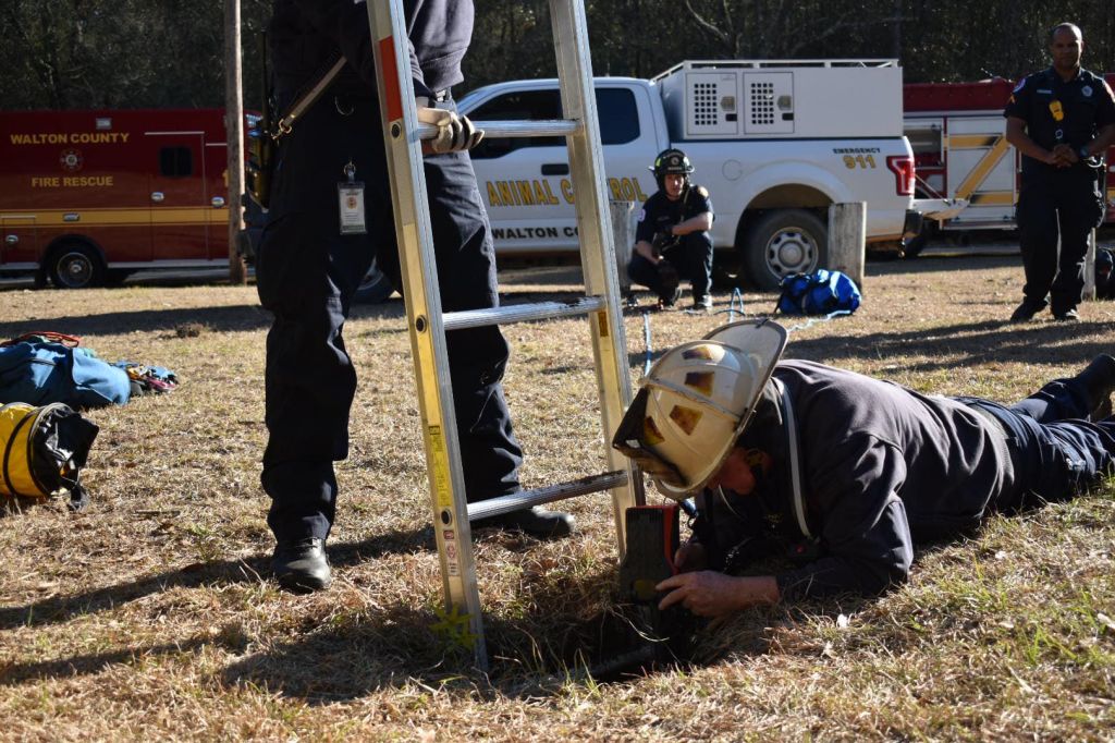 Photos: Florida firefighters rescue dog trapped down 15-foot hole