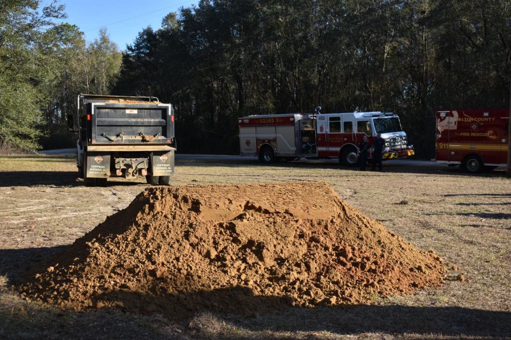 Photos: Florida firefighters rescue dog trapped down 15-foot hole