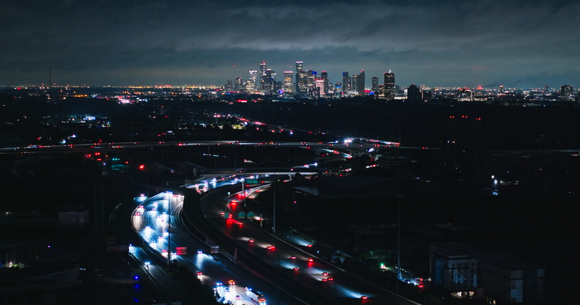 Drone Shot of Interstate 10 with Houston Skyline in the Distance at Night
