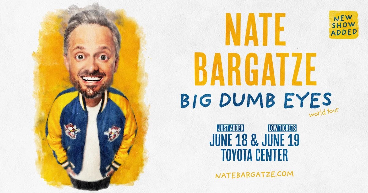 A smiling man with a beard wearing a blue and yellow jacket, promoting a "Nate Bargatze: Big Dumb Eyes" comedy tour at the Toyota Center on June 18 and 19.