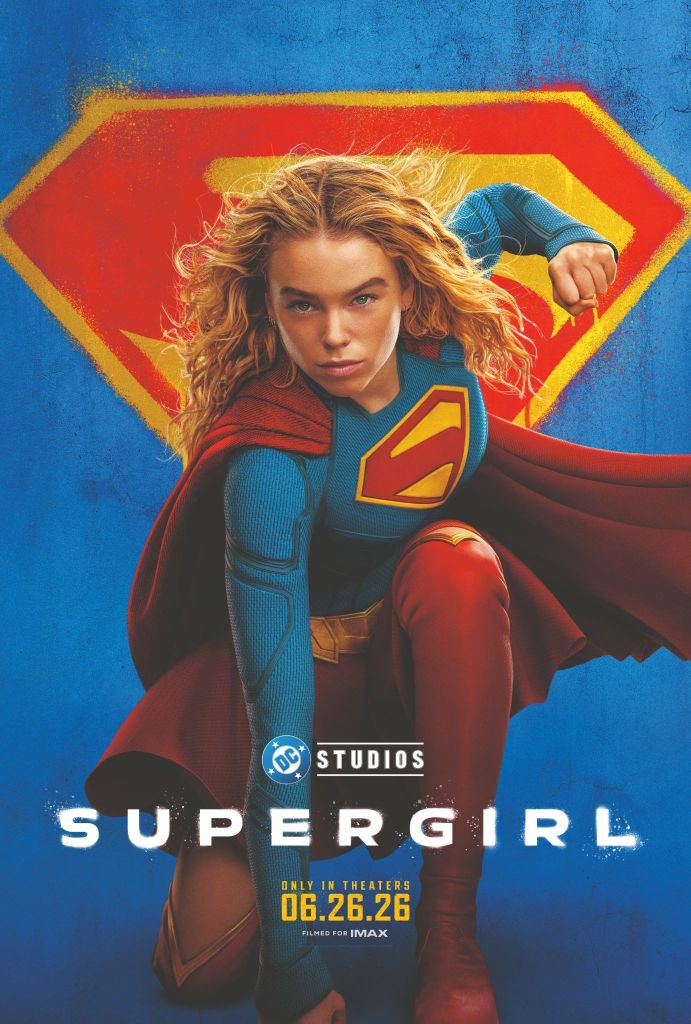 A woman in a superhero costume with a red cape and "S" symbol on her chest stands in front of a colorful background with the text "SUPERGIRL" and "DC STUDIOS" visible.