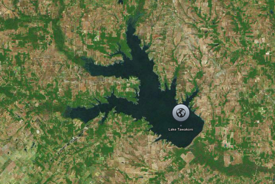 Aerial view of Lake Tawakoni, a large lake surrounded by rural, forested areas.