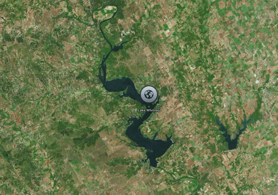 Aerial view of Lake Whitney, a large lake surrounded by rural and forested areas.