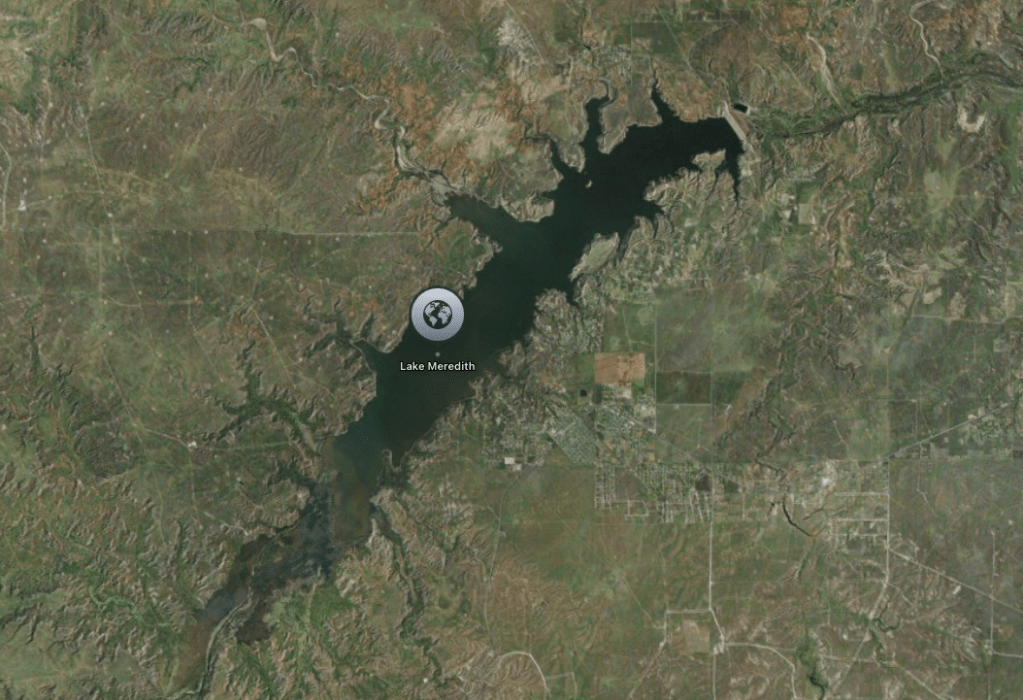 Aerial view of Lake Meredith, a large lake surrounded by rural countryside.