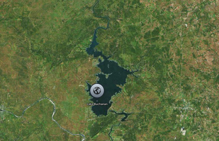 Satellite image of Lake Buchanan in Texas, surrounded by green forested areas.