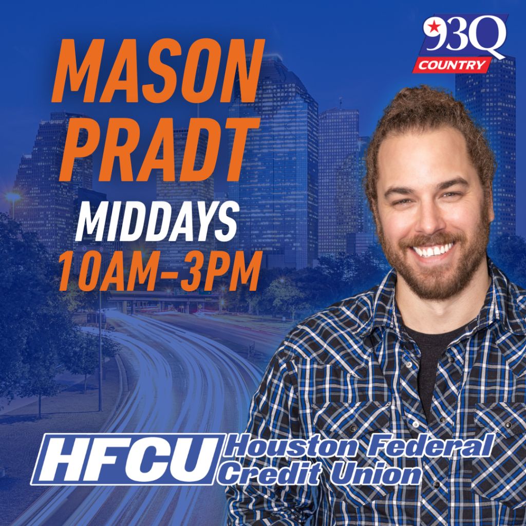 A smiling man with a beard wearing a plaid shirt stands in front of a city skyline. The text displays "MASON PRADT MIDDAYS 10AM-3PM" and "HFCU Houston Federal Credit Union" on a 93Q Country radio station logo.